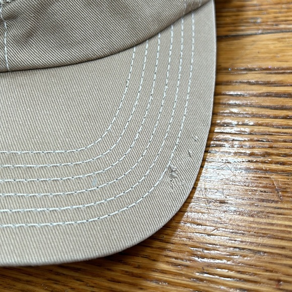 Greg Norman brand tan cap.  Velcro to adjust size in back.  Good condition. OS - Picture 3 of 8